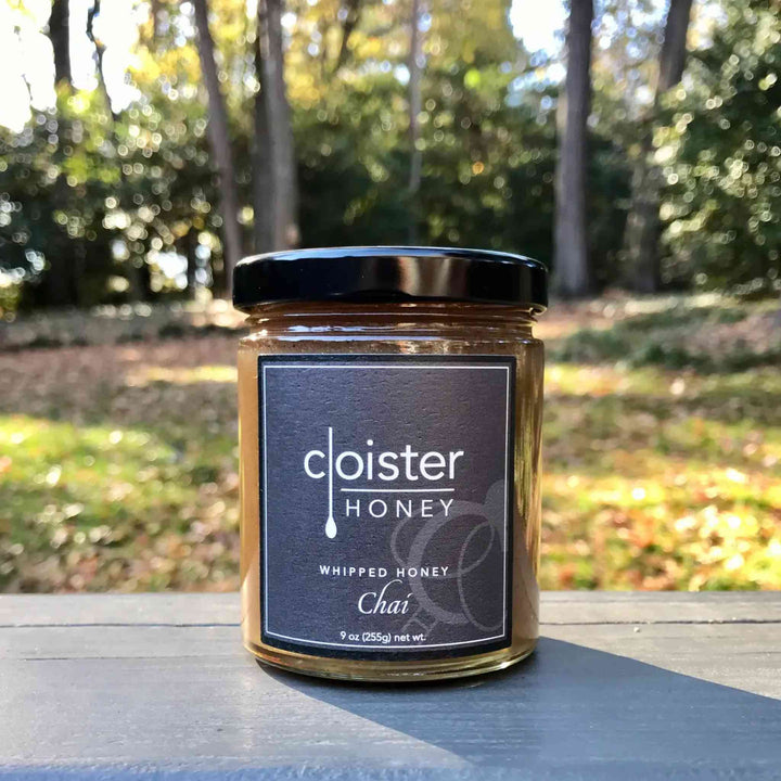 Jar of Cloister Chai Whipped Honey – creamy, spreadable honey with cinnamon, cardamom, ginger, and clove spices.