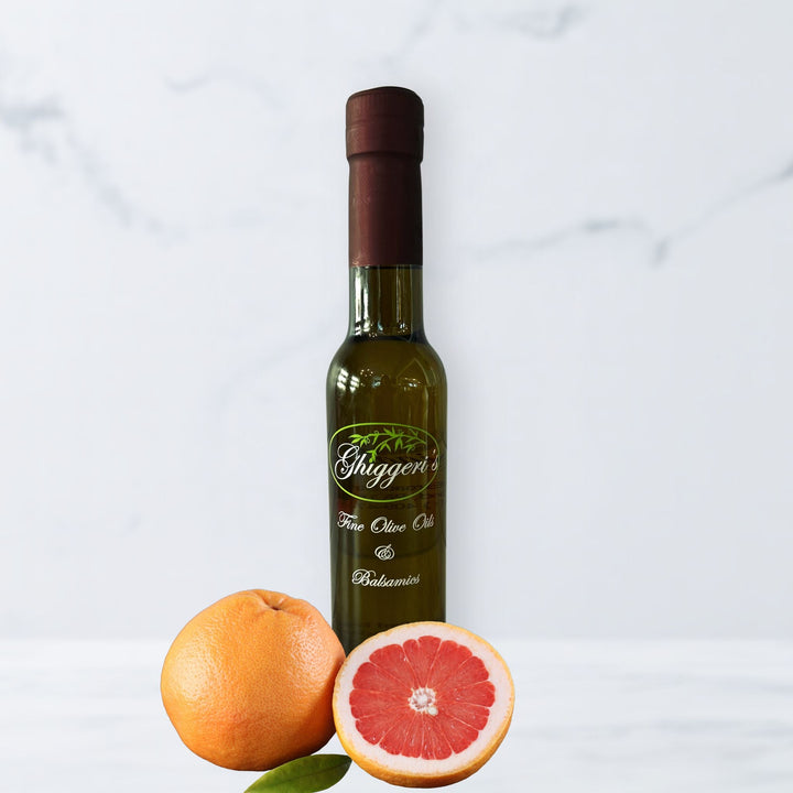 Grapefruit white balsamic vinegar bottle with sliced pink grapefruit