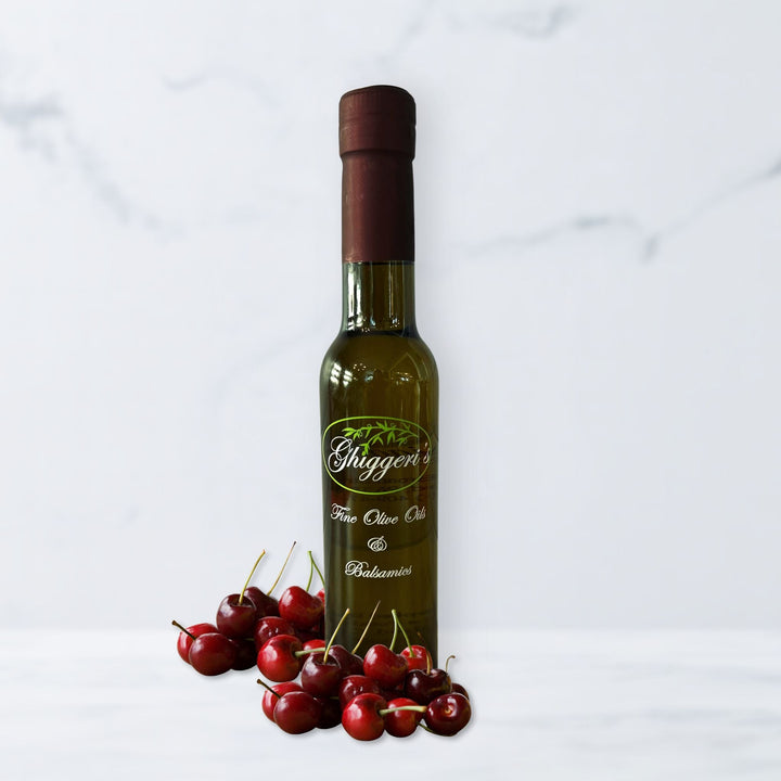 Rosé balsamic vinegar bottle with tart Montmorency cherries and soft pink hue