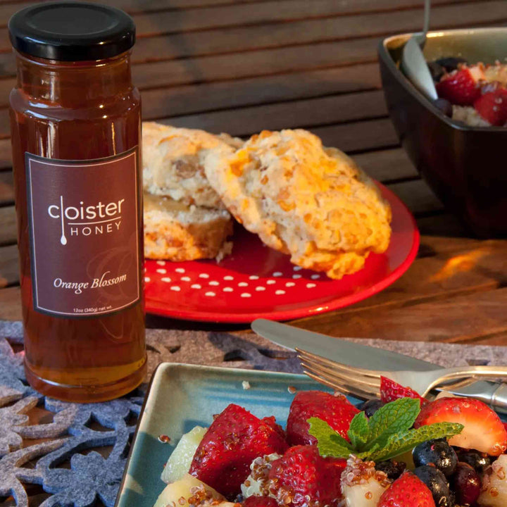 Jar of Cloister Orange Blossom Honey – golden honey with floral citrus notes.